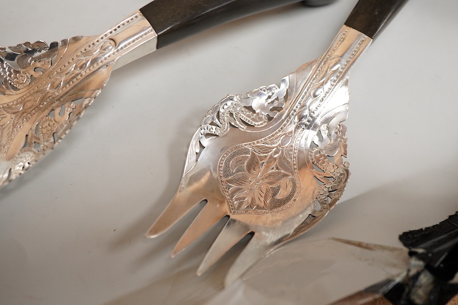 A small collection of mainly Malaysian white metal items including four hardwood handled servers, an 800 standard bowl, flower spreader and three small dishes.